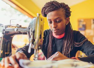 Young woman sewing
